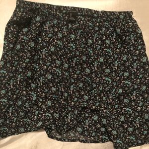 Black mini skirt with blue and white flowers